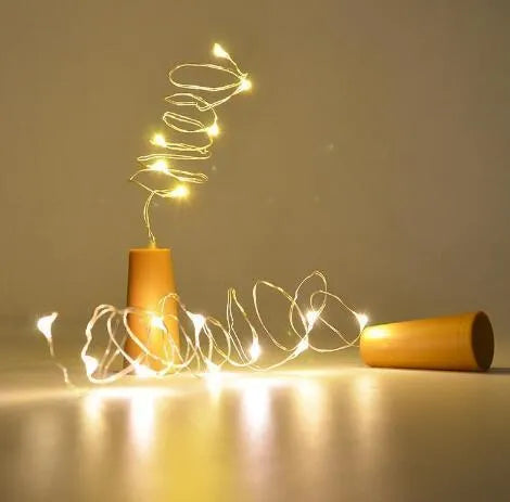 Flexible copper wire LED string lights with 20 warm white bulbs and plastic bottle stopper for wine bottle decoration