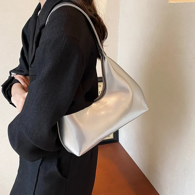 High Sense French PU shoulder bag in dumpling shape with sewing line detail and sandwich pockets