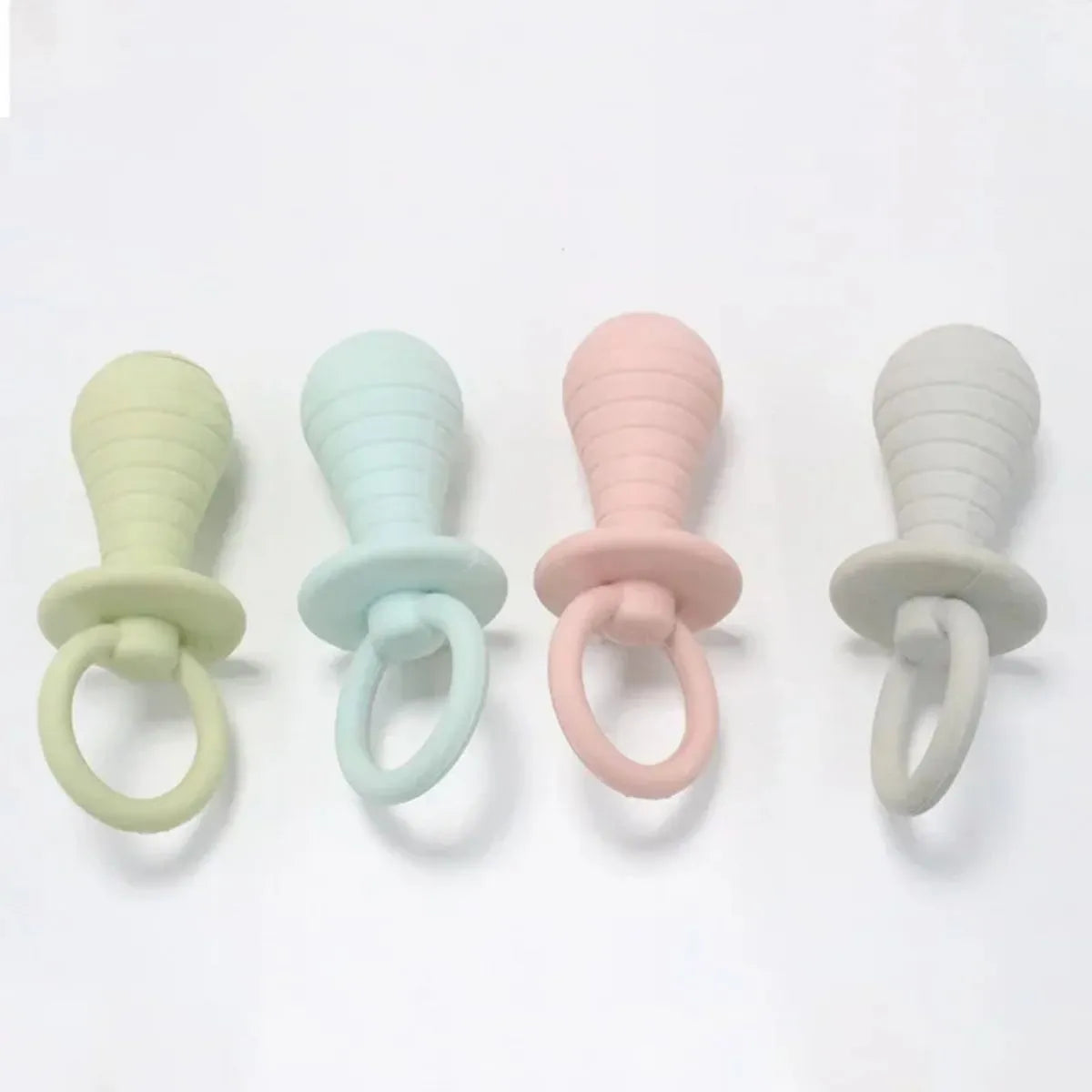 Four coloured pet pacifier chew toys with squeaker for puppies and kittens