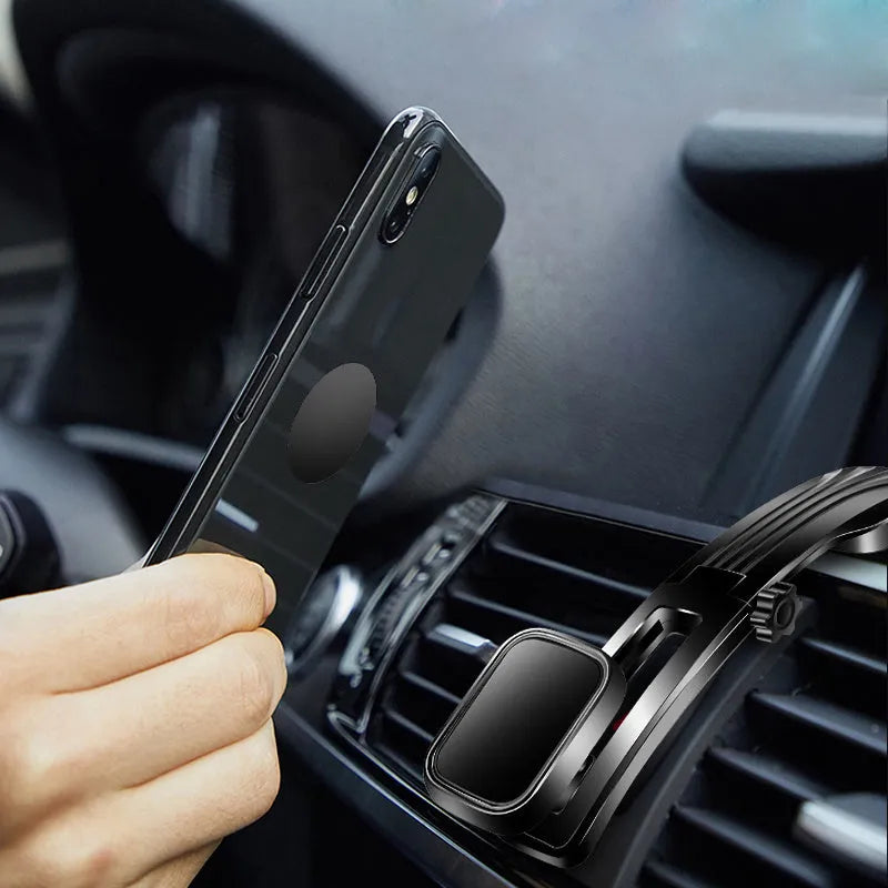 Magnetic car phone holder on dashboard with metal plate, 360° rotating arm, black and silver finish