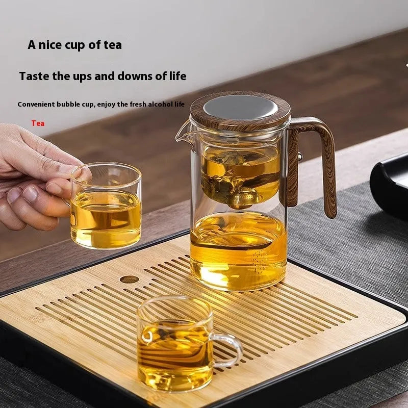 Glass teapot with magnetic separation button, walnut wood handle, and Chinese style design on tea tray