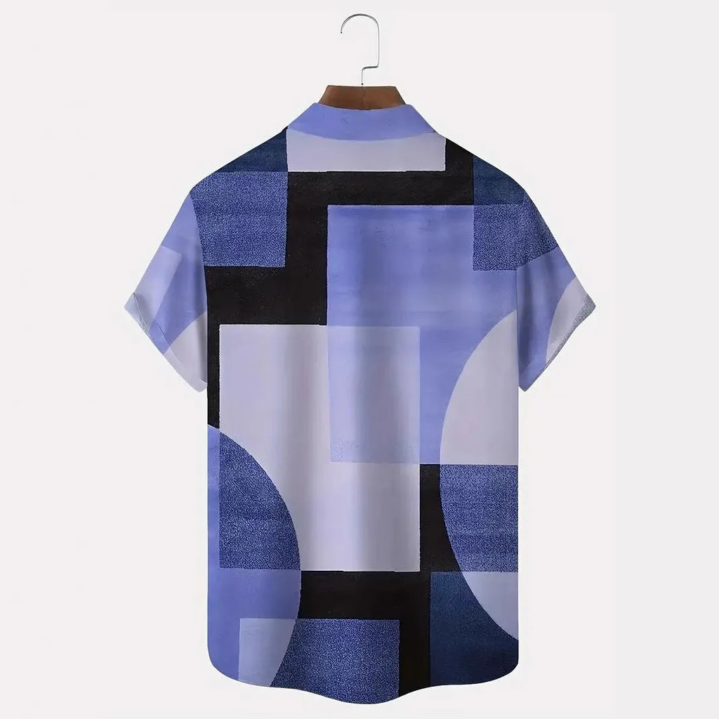 Man wearing a loose-fit short sleeve cardigan shirt with a blue and white geometric 3D print pattern.