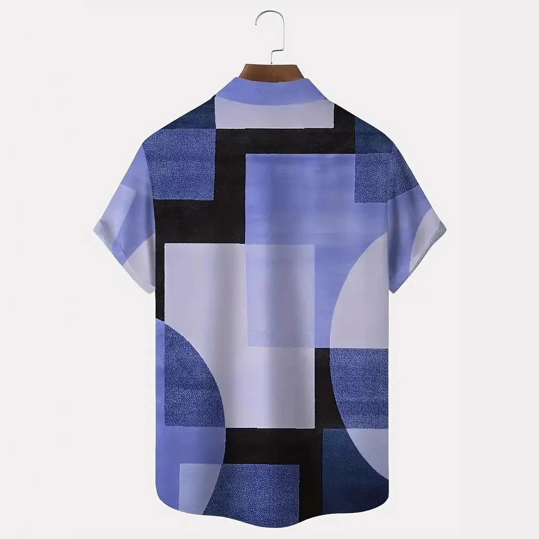 Man wearing a loose-fit short sleeve cardigan shirt with a blue and white geometric 3D print pattern.