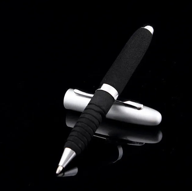 Silver EVA metal cap ballpoint pen with a 1.0mm tip on a notepad.