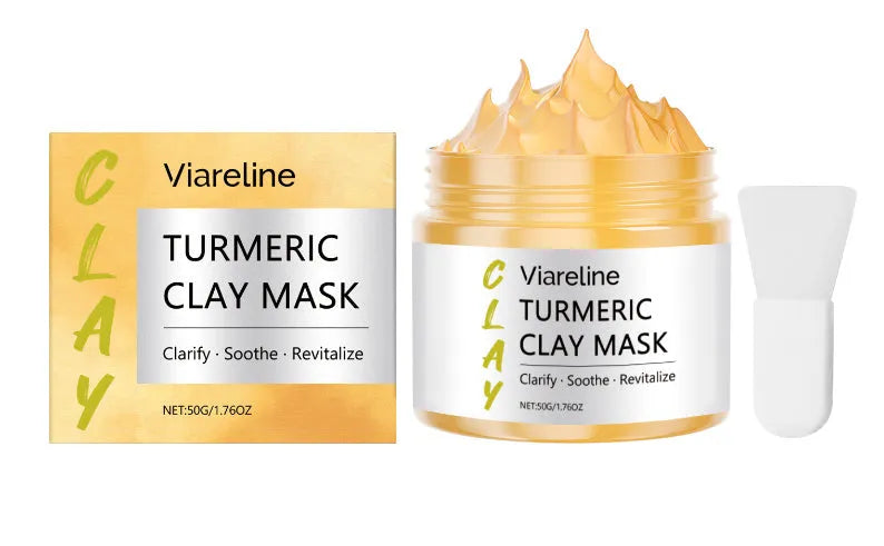 Yellow turmeric mud face mask in 50g pot with an accompanying mask brush on a white background