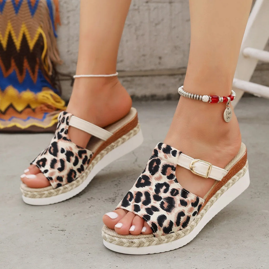 Leopard print women's platform wedge sandals in beige, shown from the side on a white background.