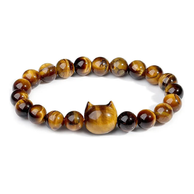Handmade natural stone bead bracelet with silver cat pendant on neutral background