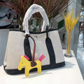 Women's canvas genuine leather bucket tote bag with crossbody strap and internal organisation pockets