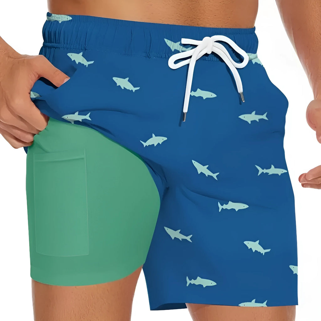 Men's shark figure straight-leg drawstring shorts in blue, shown on a model.