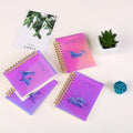 A7 spiral notebook with colourful PP cover, showing spiral binding and open pages