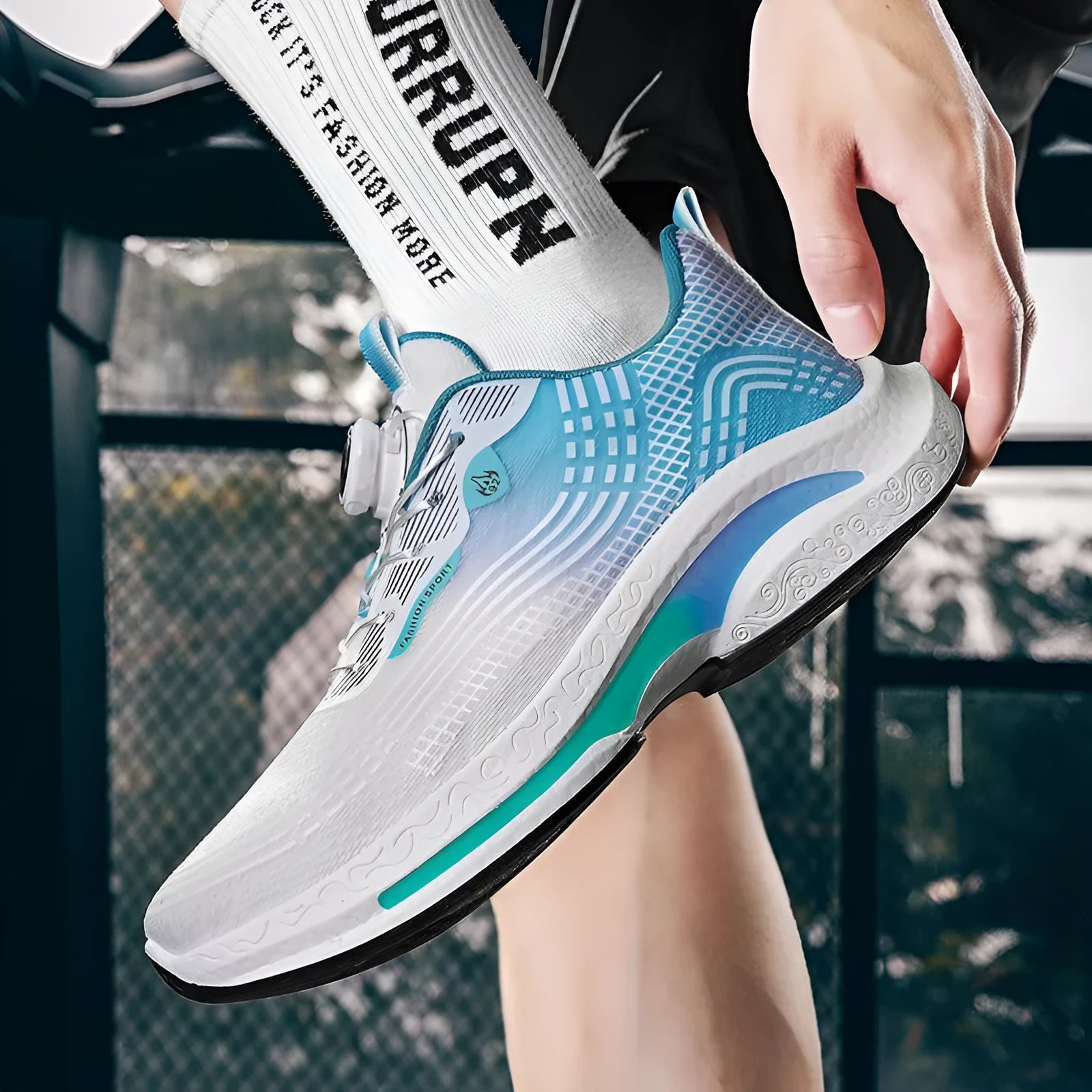 Men's low-top mesh sneaker with a rotating buckle in white and blue colourway.