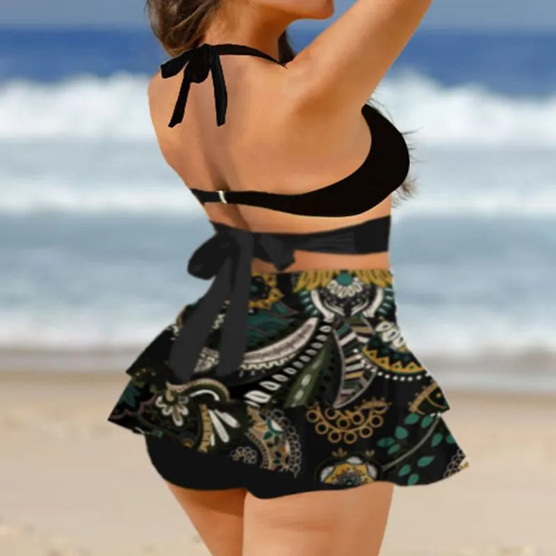 Purple women's high-waisted bikini swimsuit with lace-up detail and matching skirt for swimming