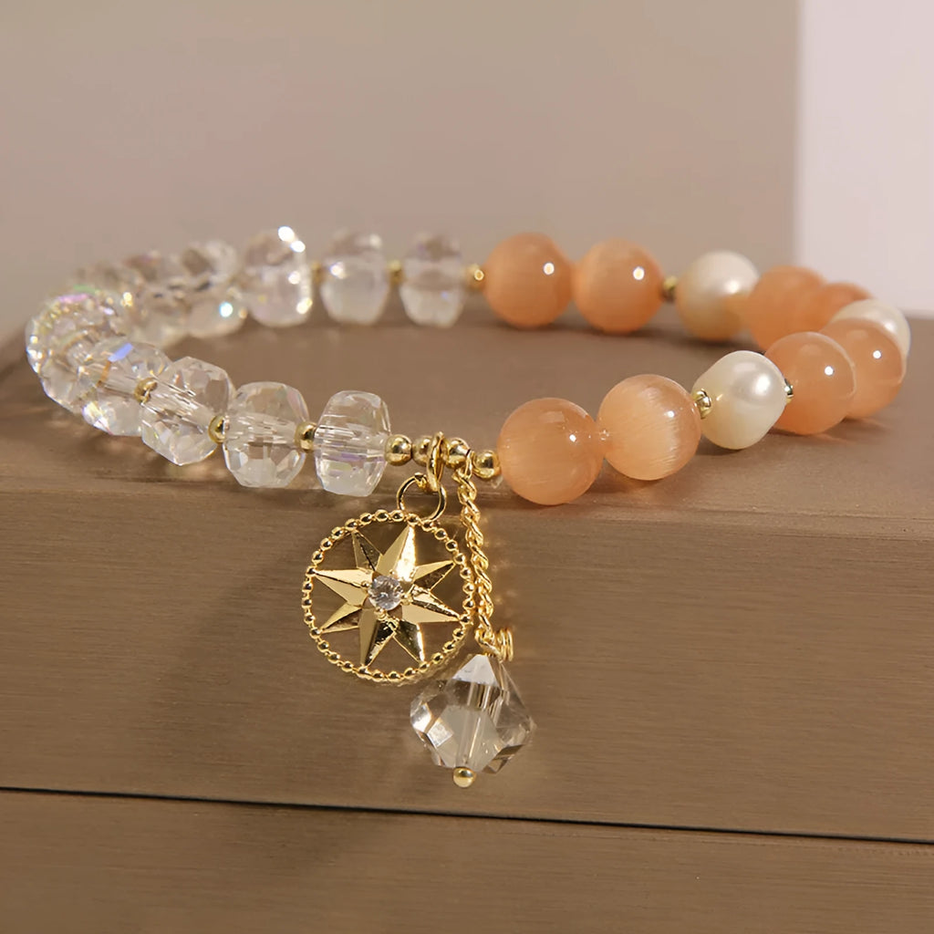 Gold-plated women's bracelet with orange crystal eight Awn star design