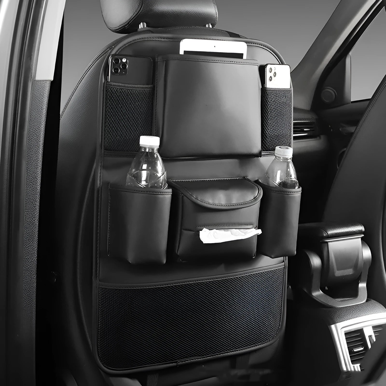 Leather car seat back storage bag hanging from a headrest, shown in grey colour.