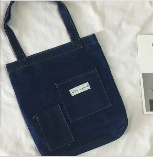 Shoulder bag with soft handle and inner patch pocket available in multiple colours including dark blue