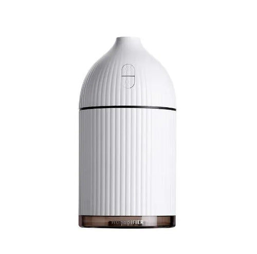 White USB-powered ultrasonic aromatherapy diffuser and humidifier with LED light on a wooden surface.