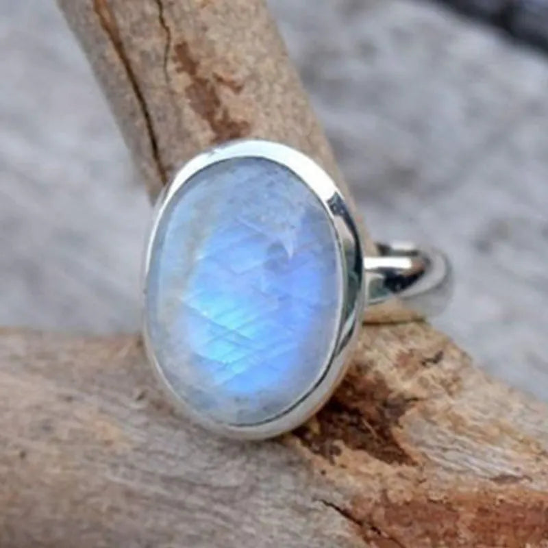 Silver alloy vintage Thai moonstone flower ring for women on plain background