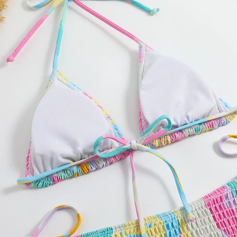 Women's triangle bikini swimming suit with floral gradient pattern and smocking craft detailing