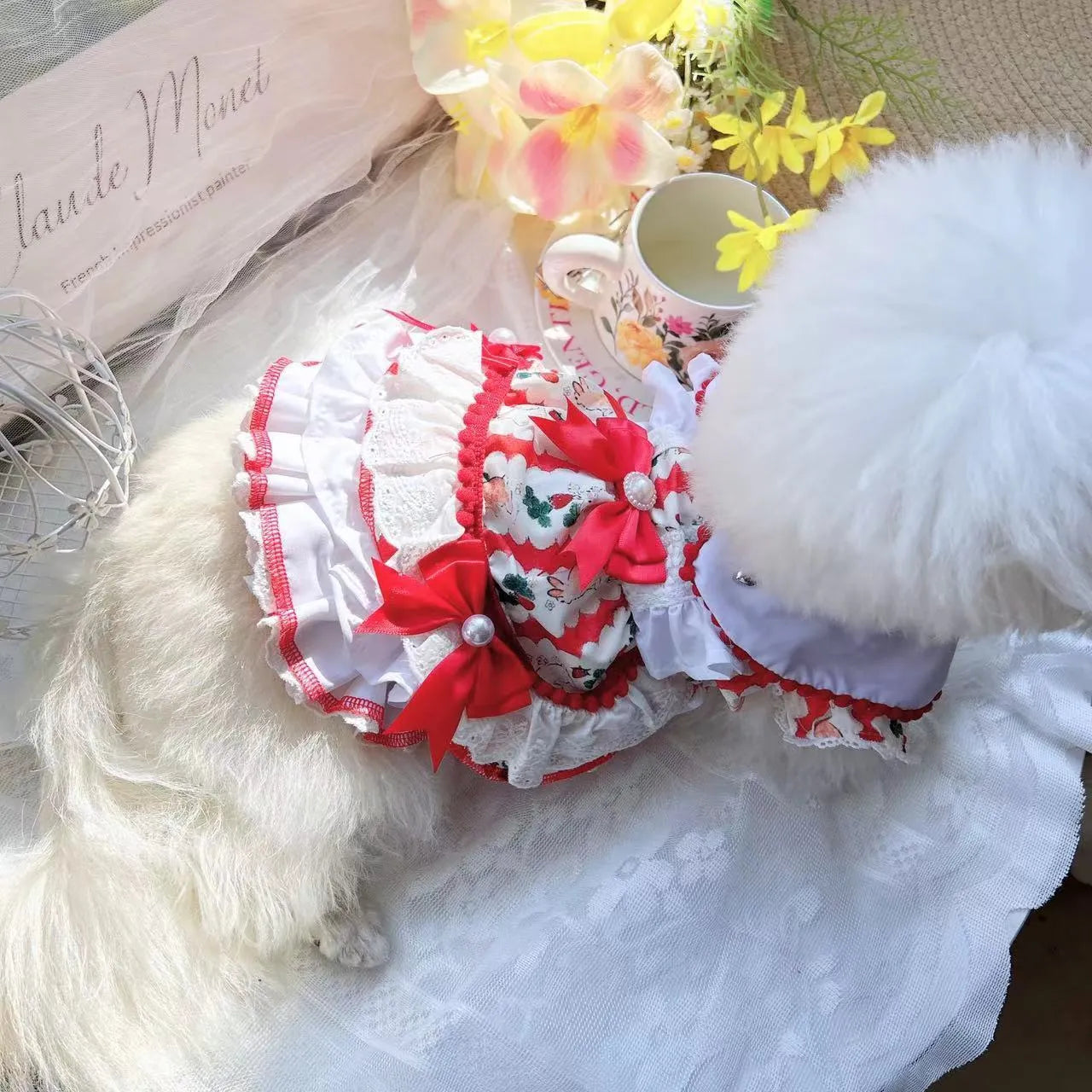 Small white dog wearing a rabbit skirt-style princess dress, showcasing the fit and lightweight polyester material.
