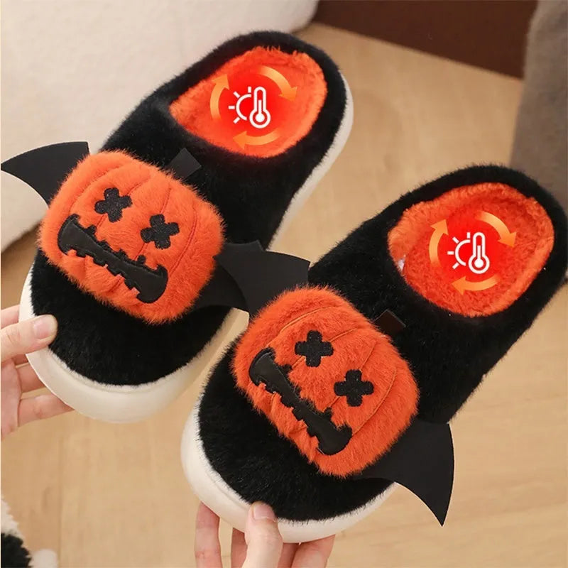 Black Halloween cartoon pumpkin slippers with small wings design on indoor floor