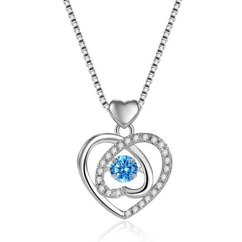Blue diamond heart necklace and bracelet set with adjustable chain on copper background