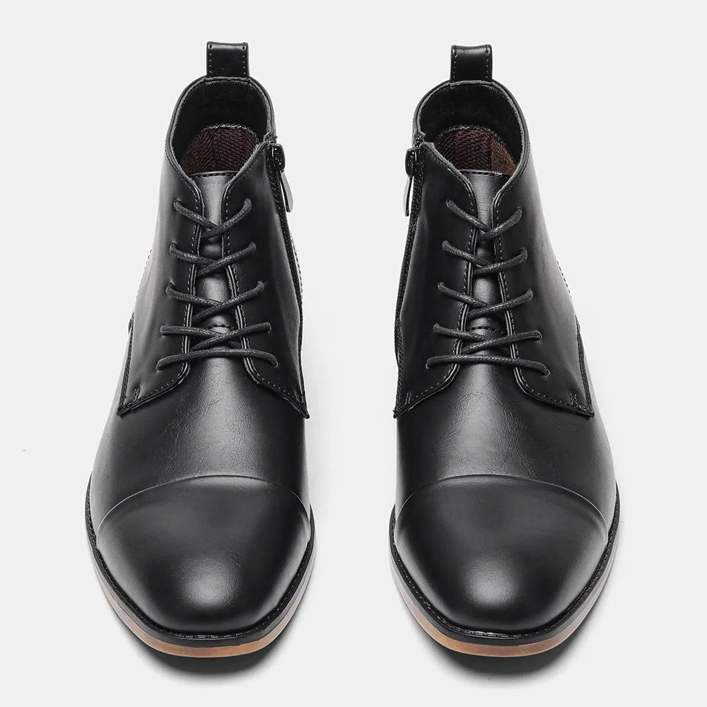 Men's brown Chelsea boot with a side zip, round toe, and low wooden heel on a white background.