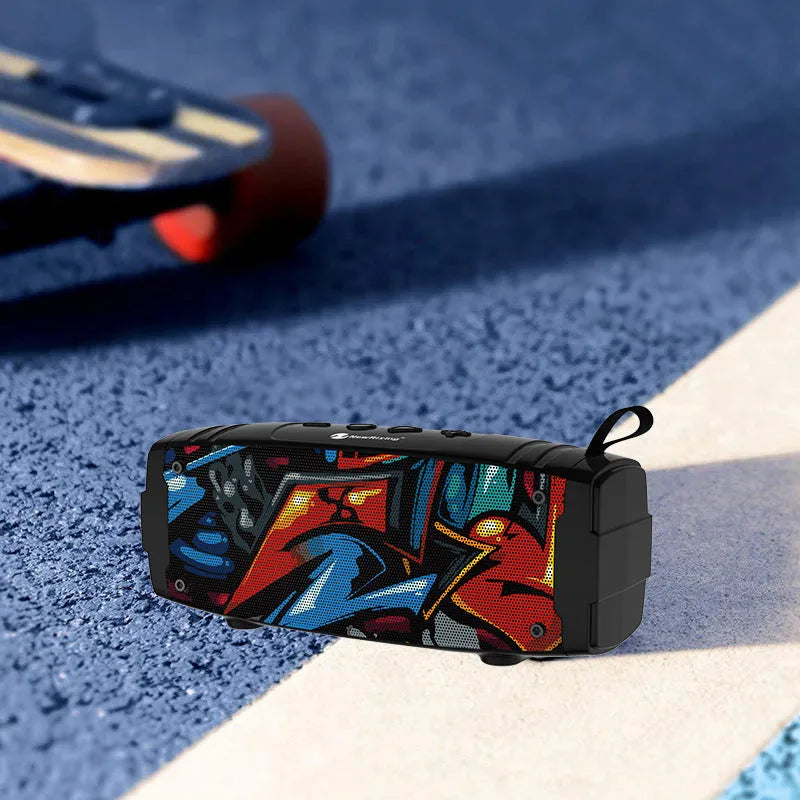 Portable Bluetooth speaker in multiple colours showing front speaker grilles and a side USB port for charging and memory expansion.