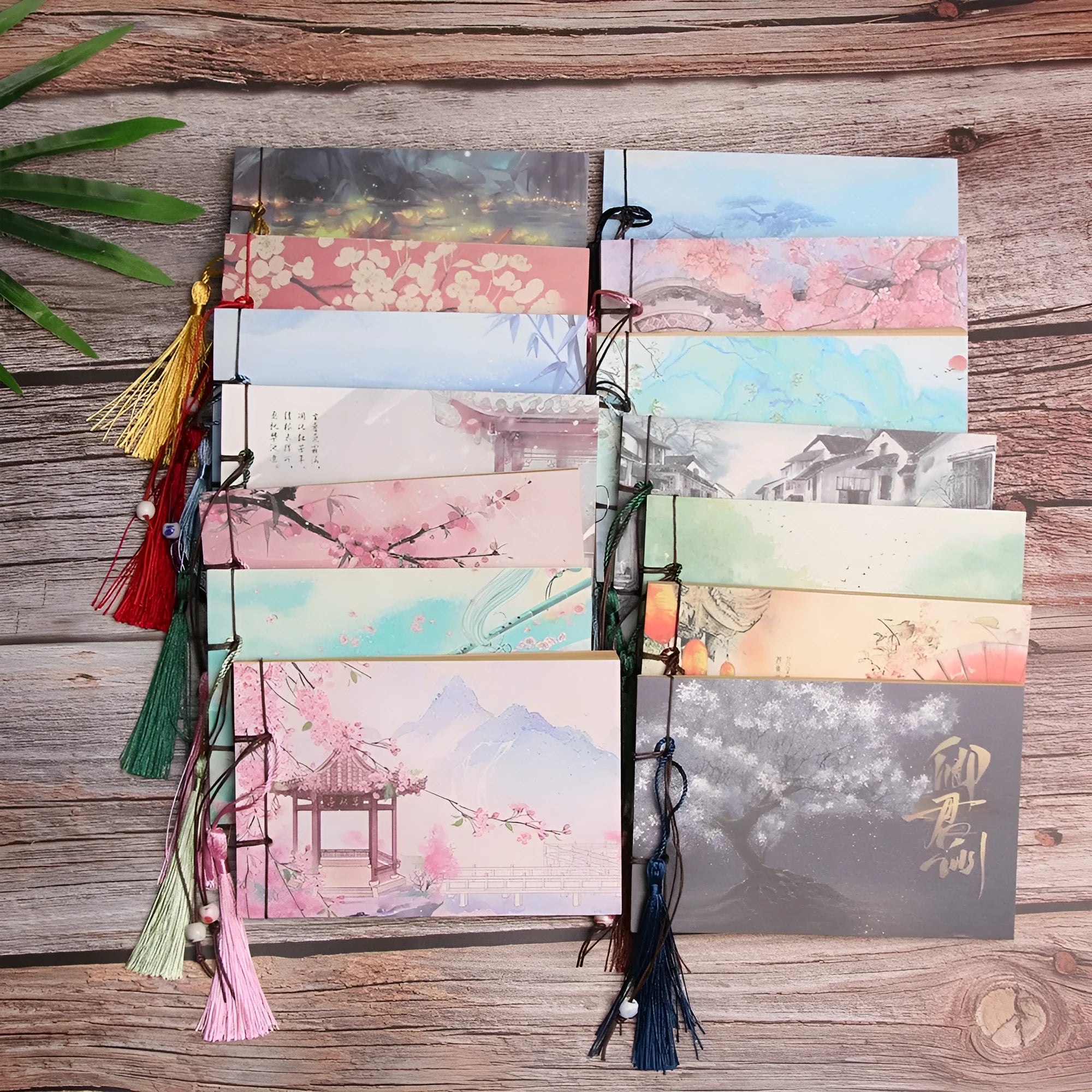 Hand-stitched kraft paper notebook with decorative tassel in a natural colour, showing page size of 12cm by 14.5cm.