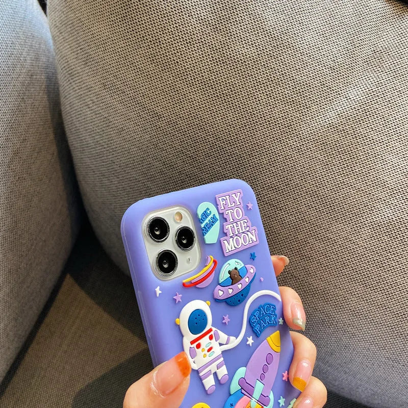 Purple silicone iPhone case featuring astronaut cartoon design for multiple model compatibility
