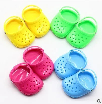 Plastic doll beach slippers in four colours: blue, red, yellow, green