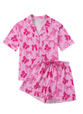 Pink bow print two-piece polyester pajama set for sleep and home wear.