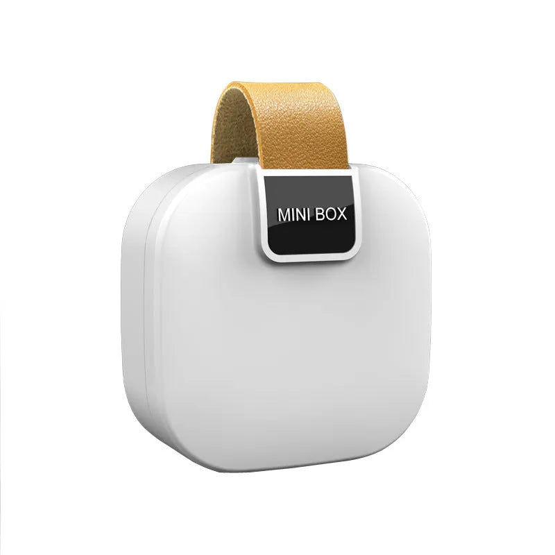 Solid colour plastic Bluetooth headset storage box with lid, 9cm by 4.5cm, in light gray.