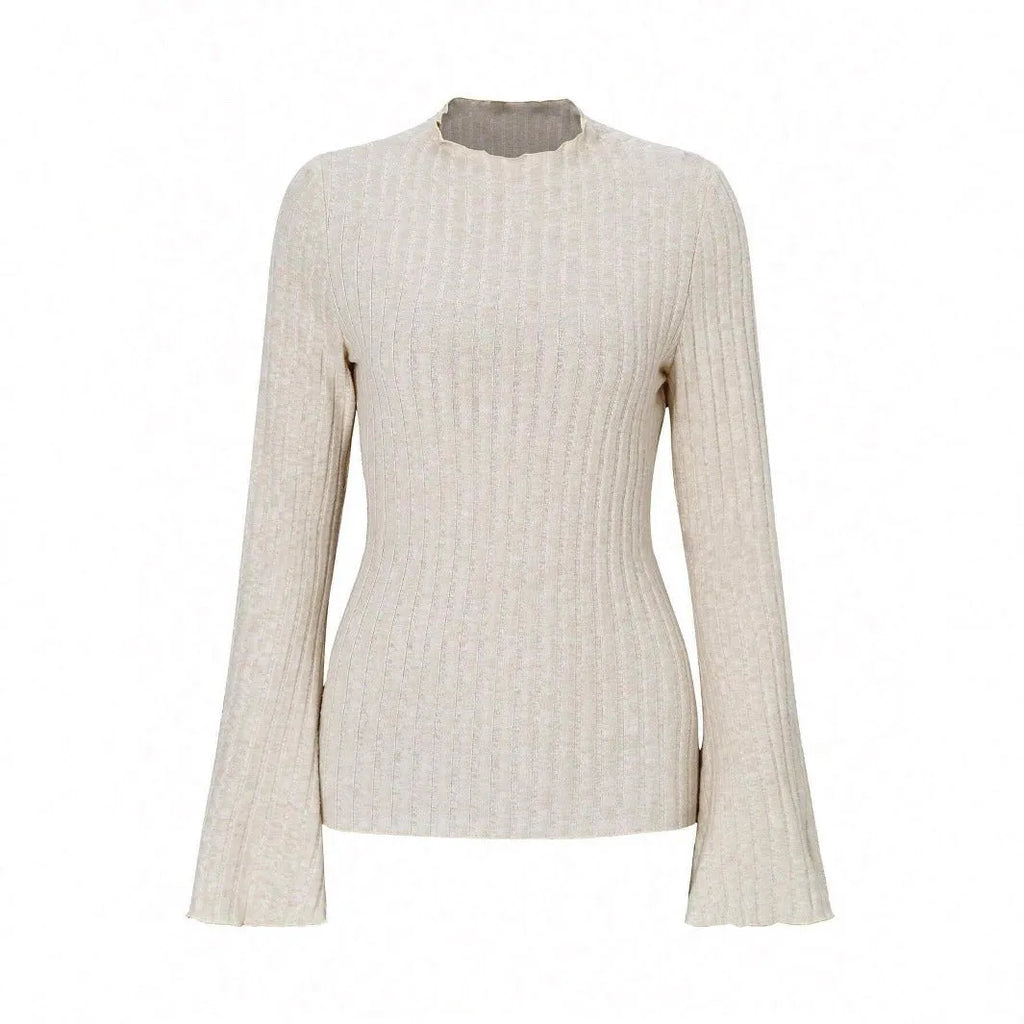 A person wearing a black long sleeve round neck top with a brushed sunken stripe texture and lantern sleeves.