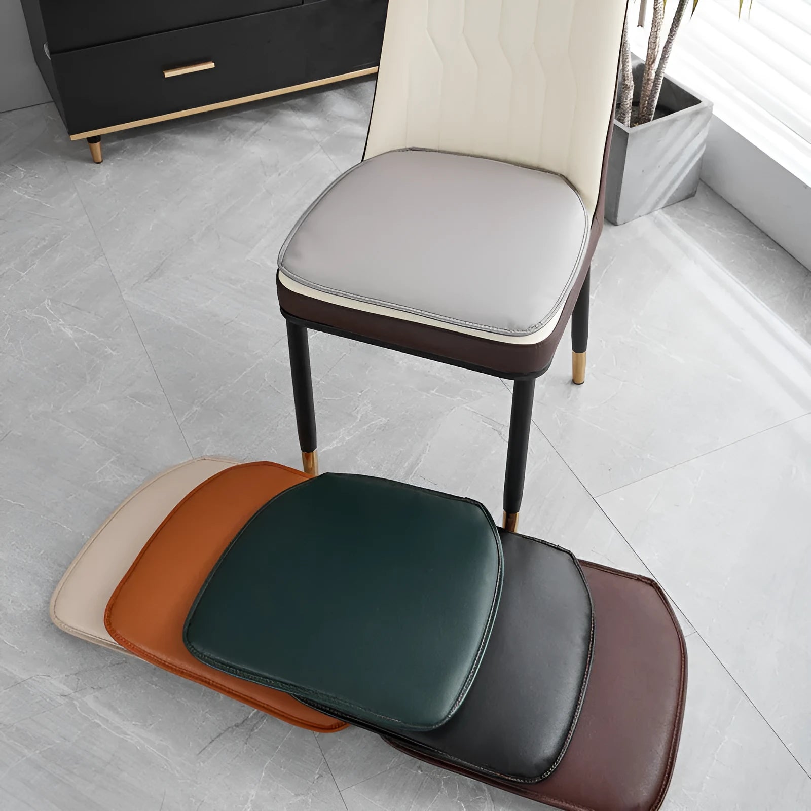 Leather horseshoe-shaped seat cushion on a chair, shown in a solid colour with a non-slip base.