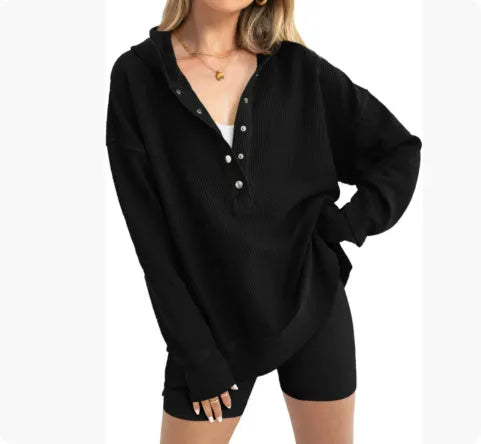 Women's loose peacock green polyester sweater with raglan sleeves, laid flat.