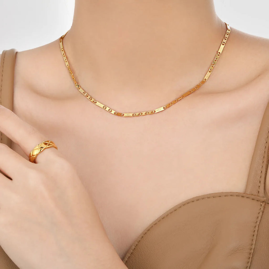 Gold electroplated titanium steel necklace with hammer pattern and Chinese character pendant on a stud chain