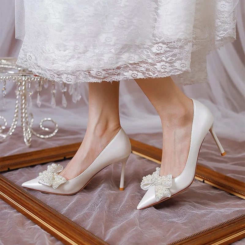 Women's stiletto heel bride wedding dress shoes in milky white with pointed toe and low top