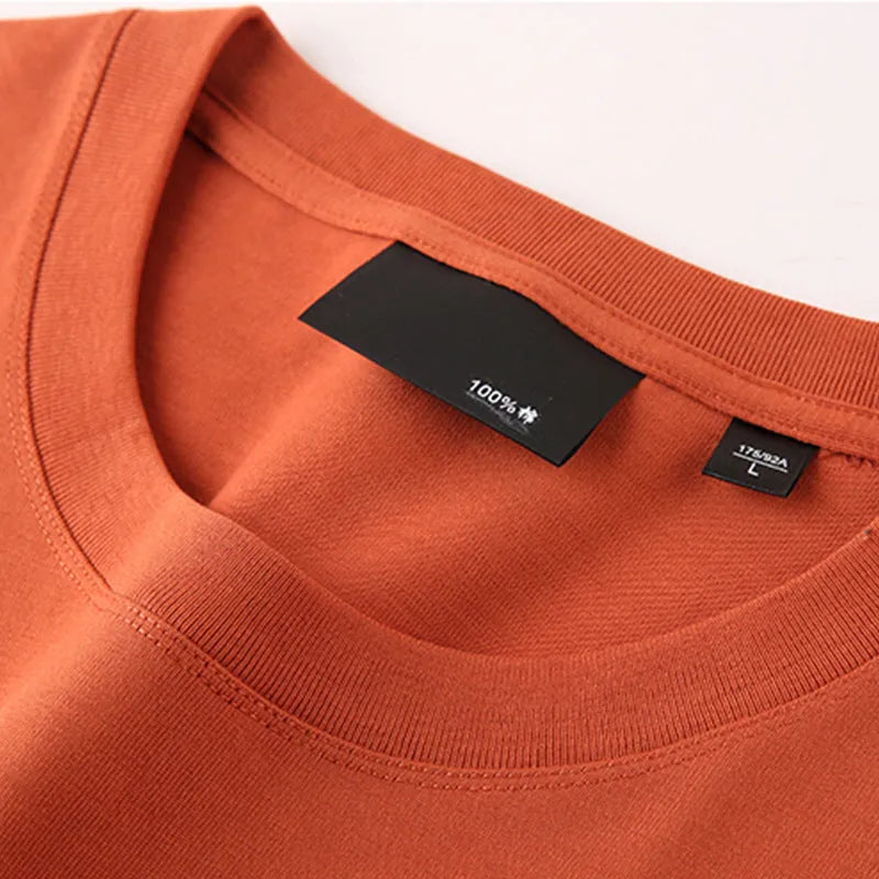 Men's loose fit cotton t-shirt with round neck and drop shoulder sleeves in solid rust red colour