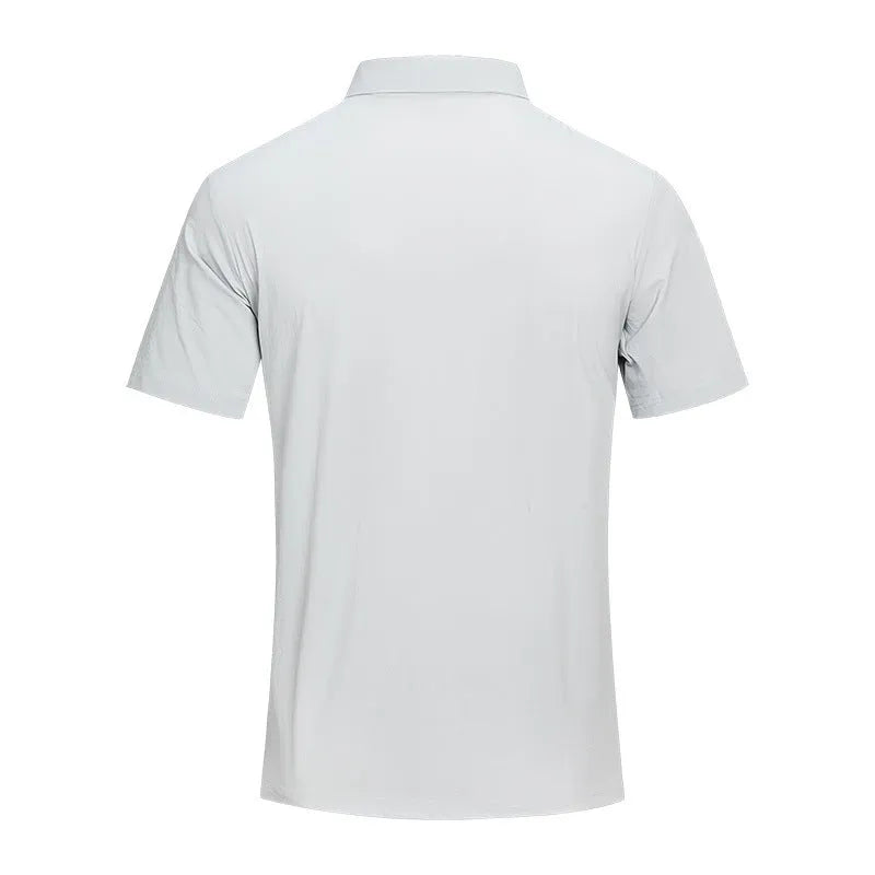 Men's solid colour polo shirt with short sleeves and slit side detail in chemical fibre blend fabric