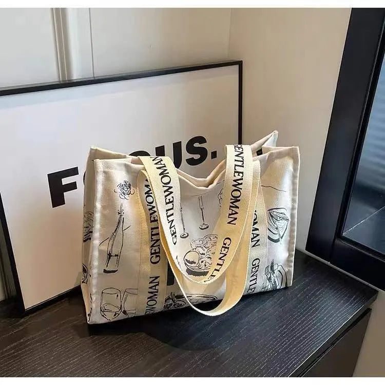 Large canvas women's tote bag with printed design options including letters and patterns