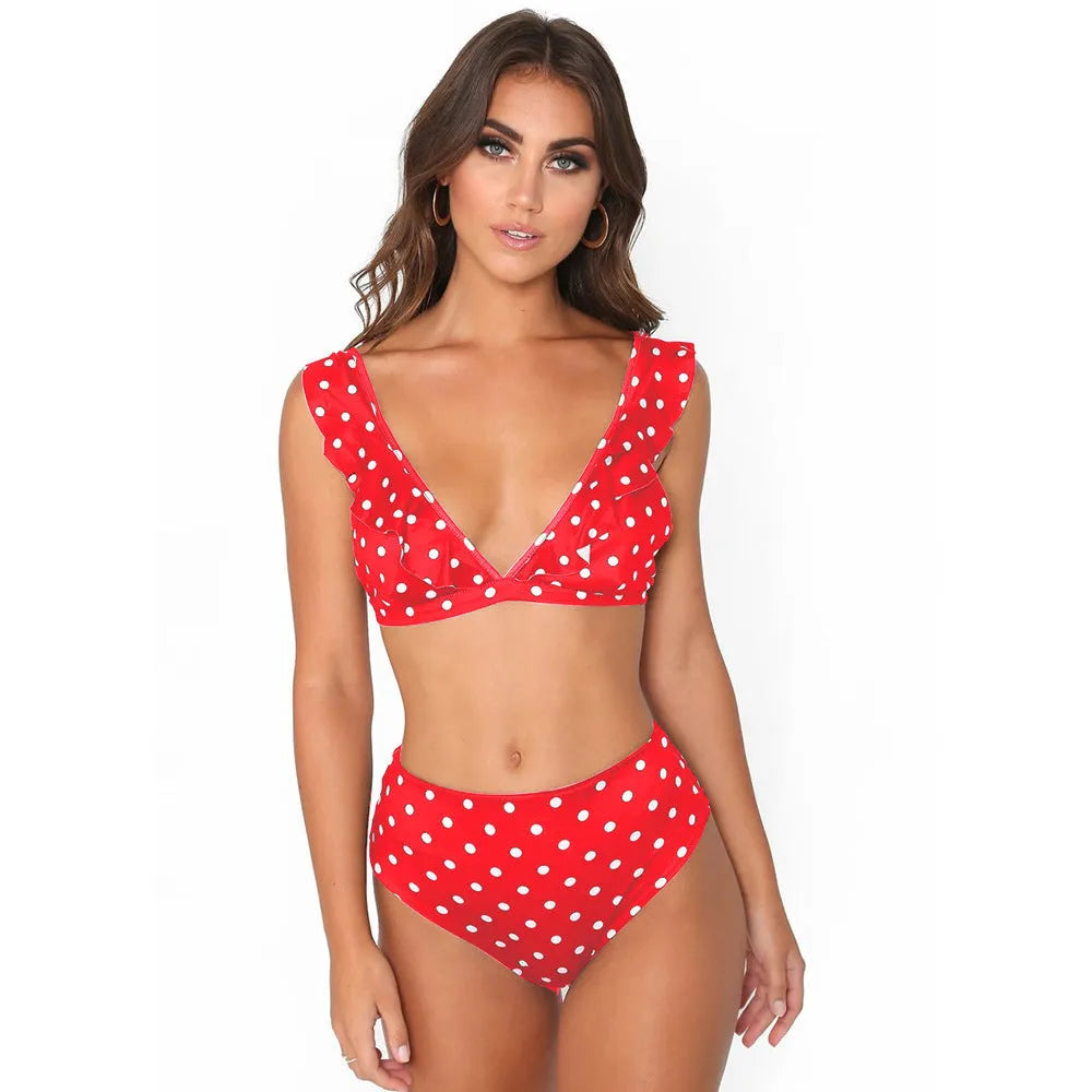 Women's black and white polka dot bikini set with deep V-neck and ruffled detailing