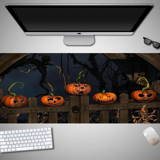 Large Halloween-themed rubber cloth mouse pad on a desk, showing non-slip backing and graphic design.