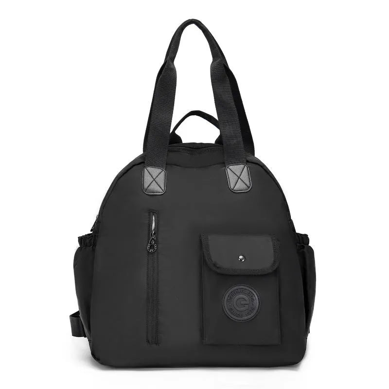 Large lightweight nylon backpack in black, shown with a sandwich pocket and main compartment.