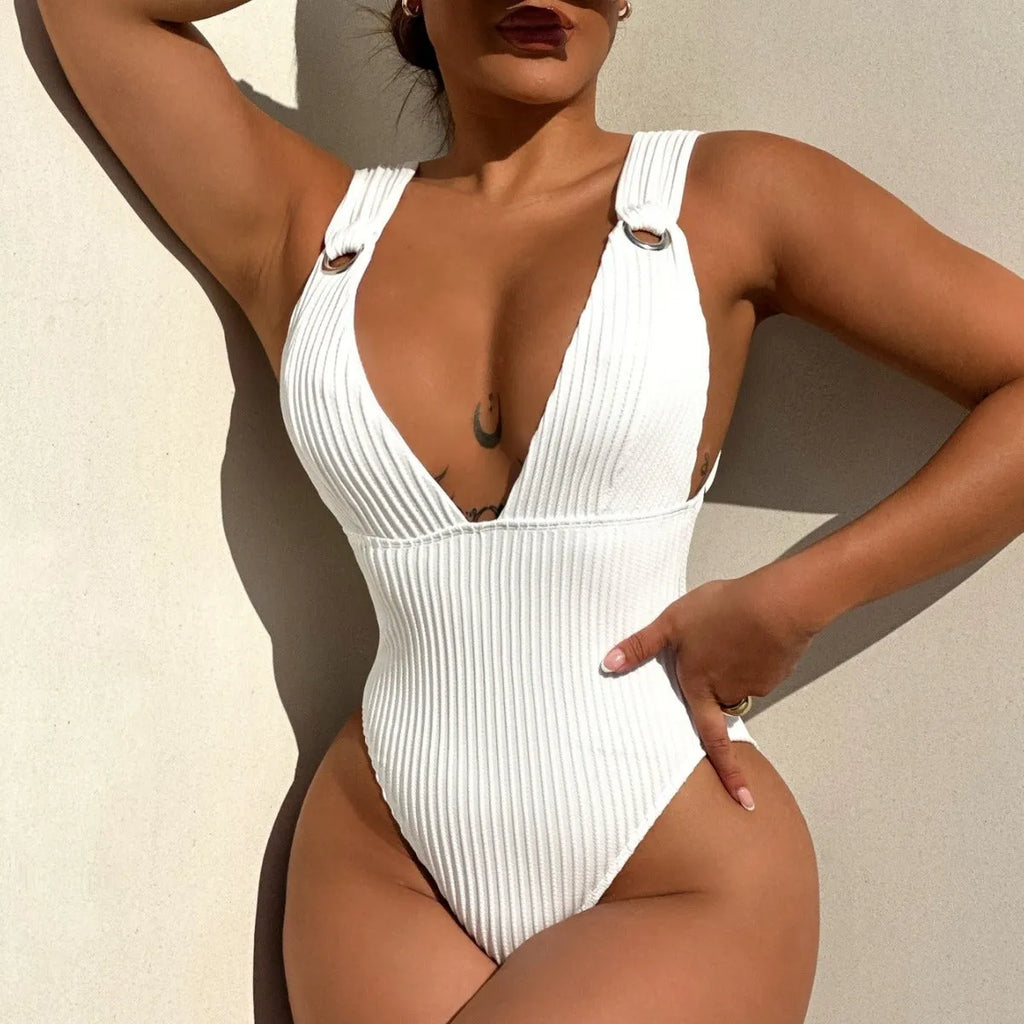 Women's solid colour one-piece swimsuit in spandex, shown in black, white, green, and orange.