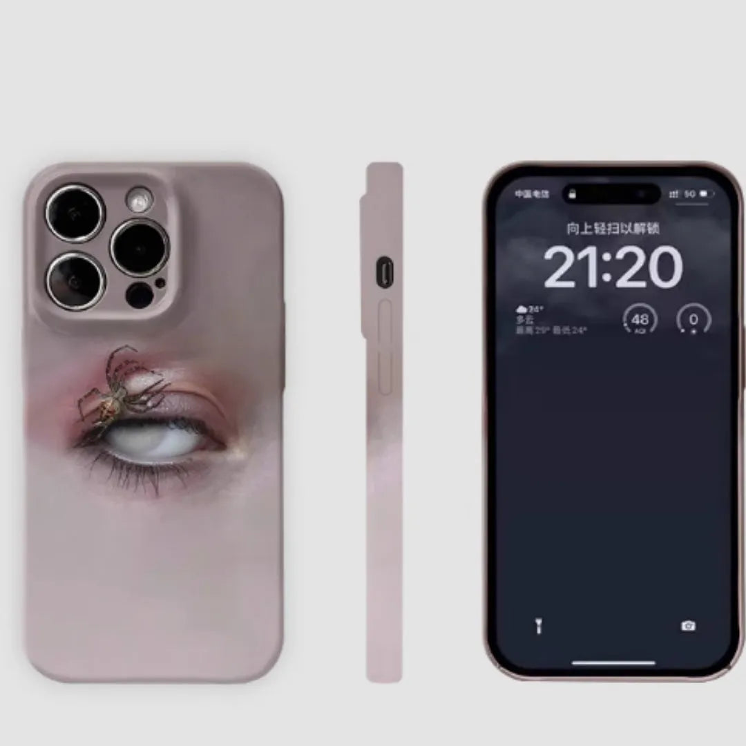 Dark heterochromatic spider design resin case for iPhone 15 Pro Max on a table
