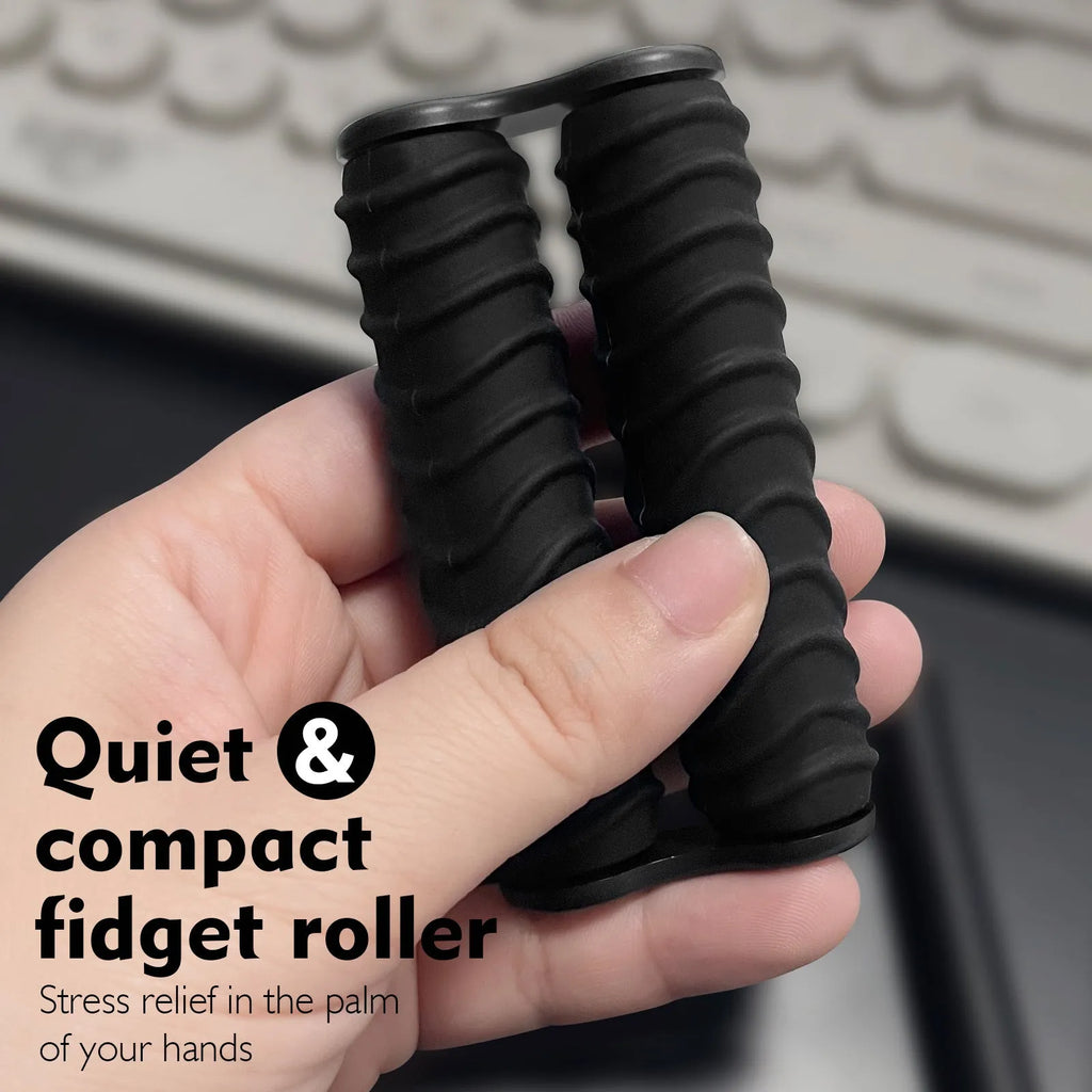 Silicone decompression roller palm massage toy in black common style on a plain background