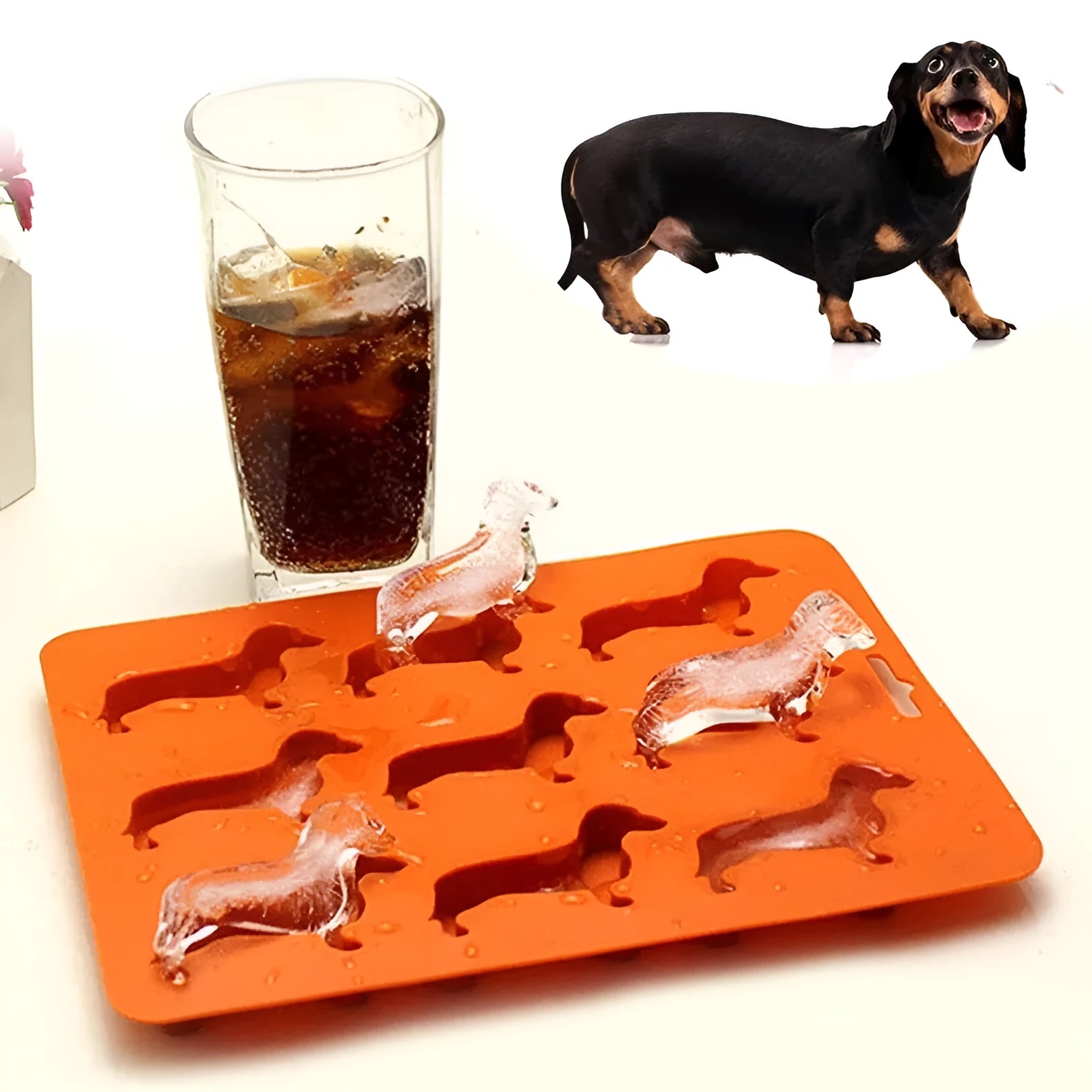 Orange silicone ice mold producing animal-shaped ice cubes for creative drinks