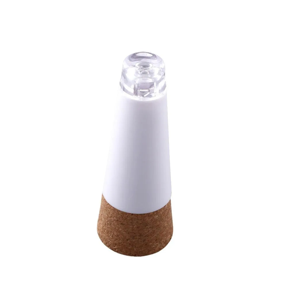 White plastic USB-rechargeable LED cork light for bottle decoration, showing compact size.