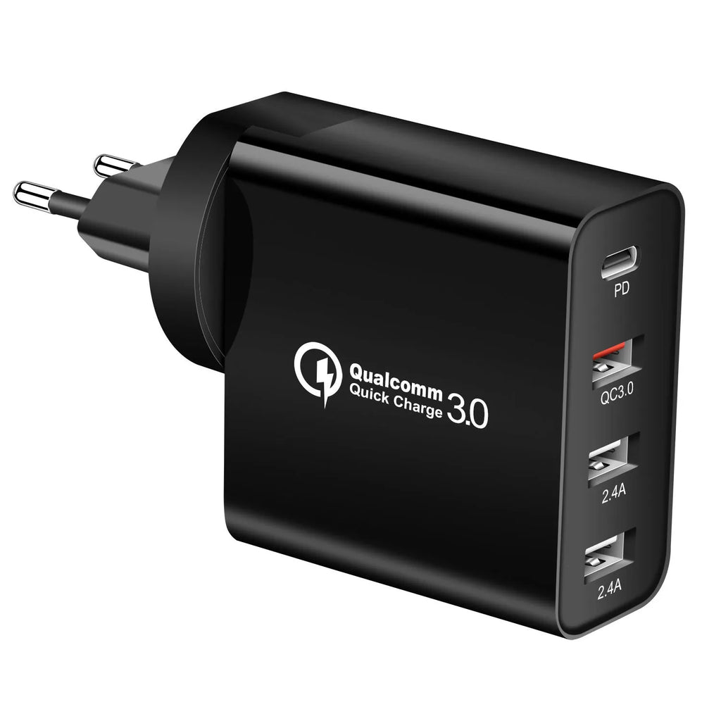Black 48W USB-C four-port fast wall charger with UK plug on a wooden surface