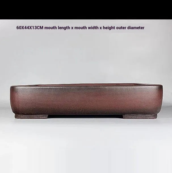 Handmade antique rectangular purple clay flower pot showing its size and natural colour.